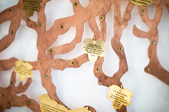 A close up on the solid brass leaf on the Giving Tree